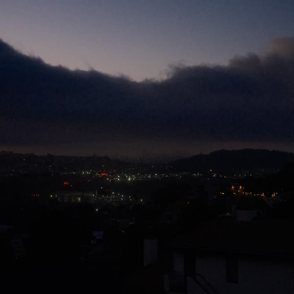 A city skyline at dusk.