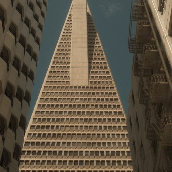A tall building with a pointed roof.
