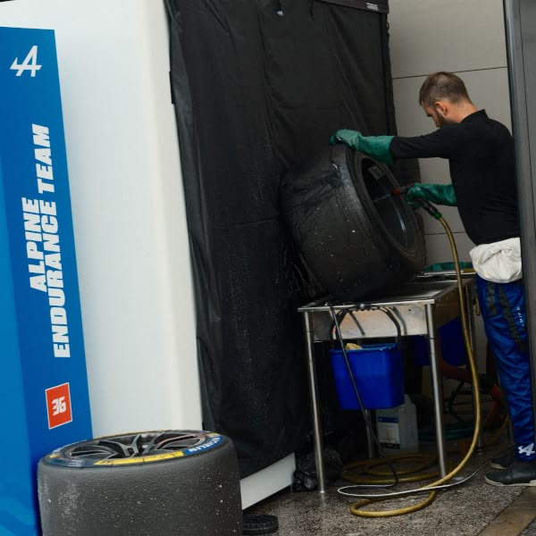 A man is working on a tire.