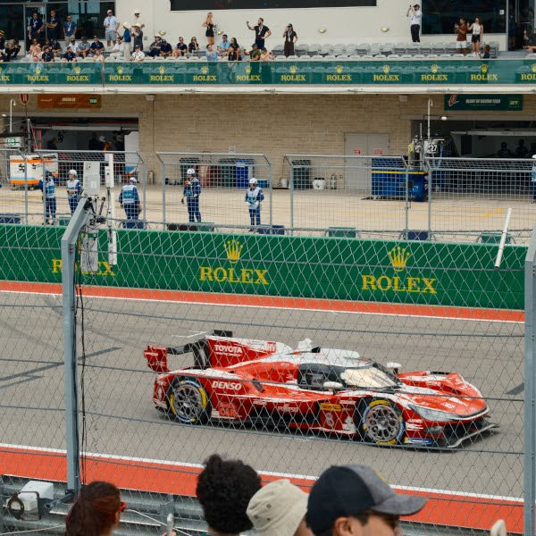 A red race car with the number 12 on it.