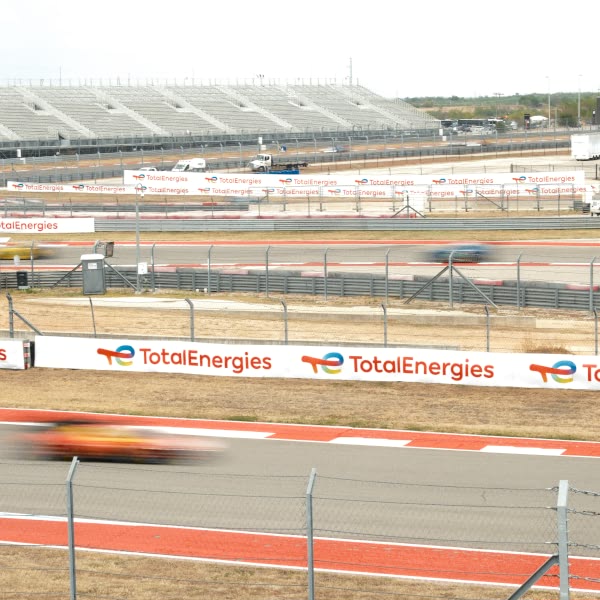 A race track with a car driving on it.