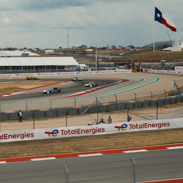A race track with cars driving on it.