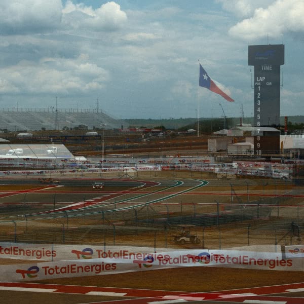 A race track with a flag and a car on it.