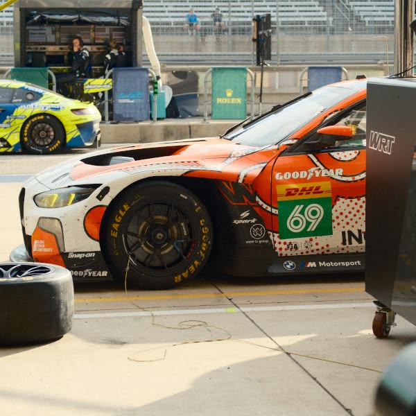 A red race car with the number 69 on it.