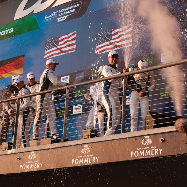 A group of people celebrating with champagne.