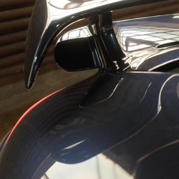 The car has a wing on the back.
