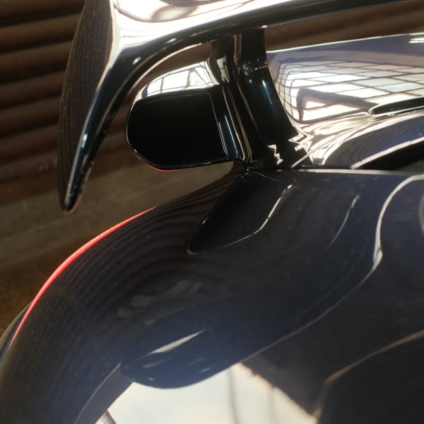 The car has a wing on the back.