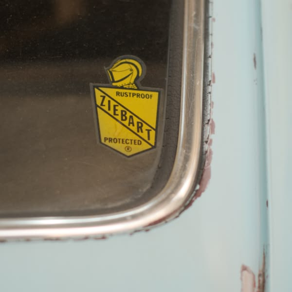 A yellow and black sticker on a window.