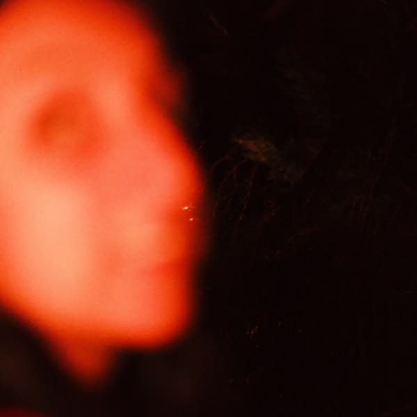 A woman with a red nose.