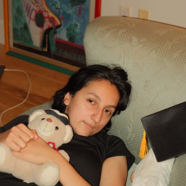 A woman holding a teddy bear.