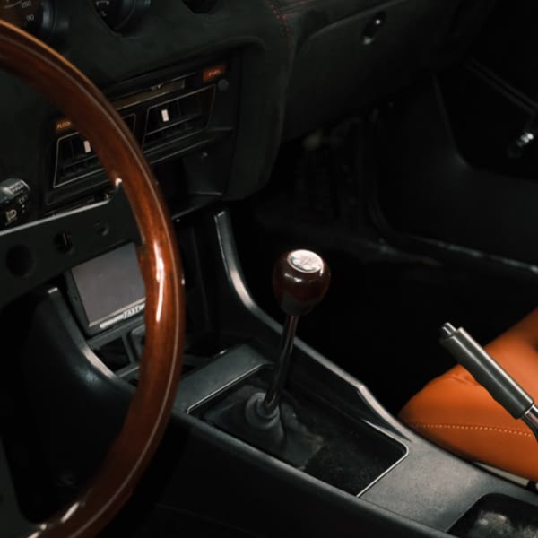 A car steering wheel with a gear shift.