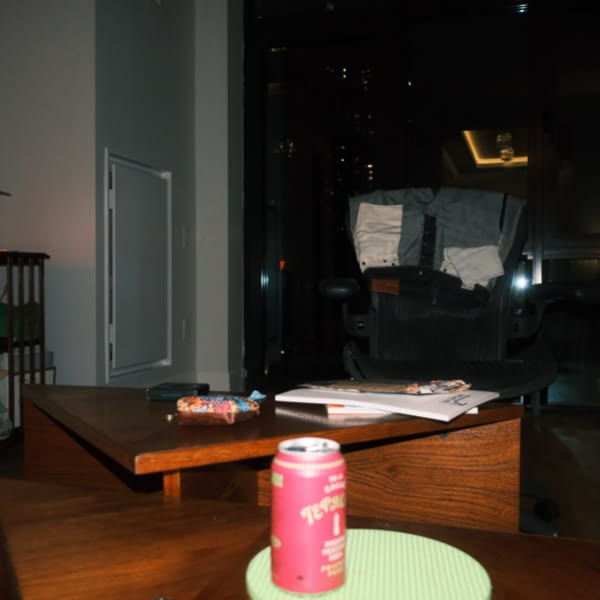 A can of beer on a table.