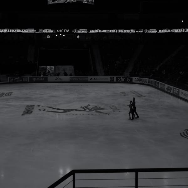 A couple skating on ice.