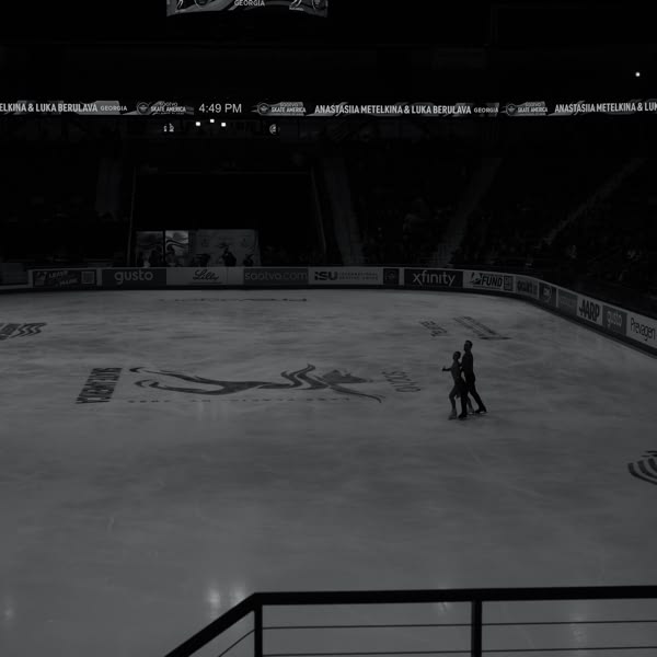 A couple skating on ice.