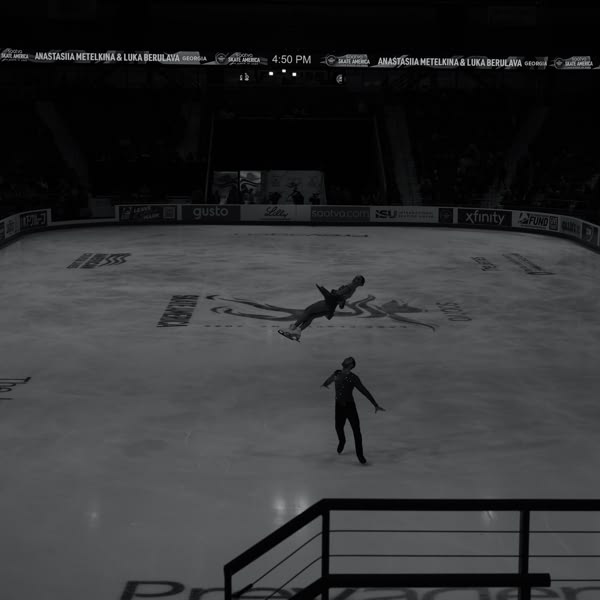 A man is skating on ice.