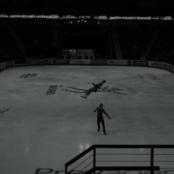A man is skating on ice.