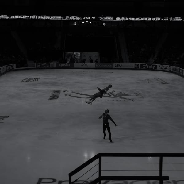 A man is skating on ice.