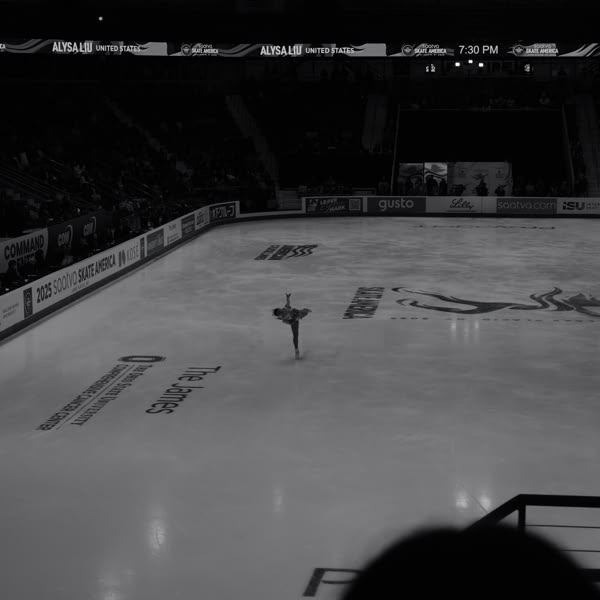 A woman is skating on ice.