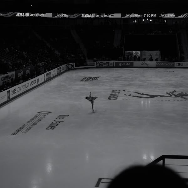 A woman is skating on ice.