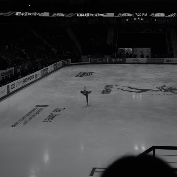A woman is skating on ice.