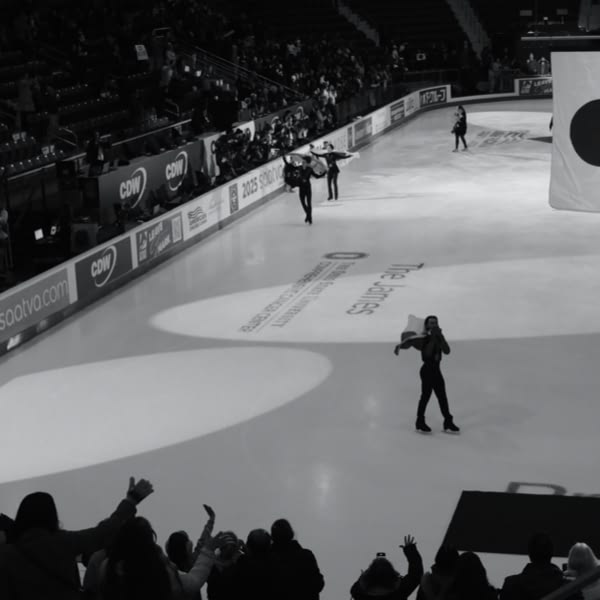 A man holding a flag on ice.