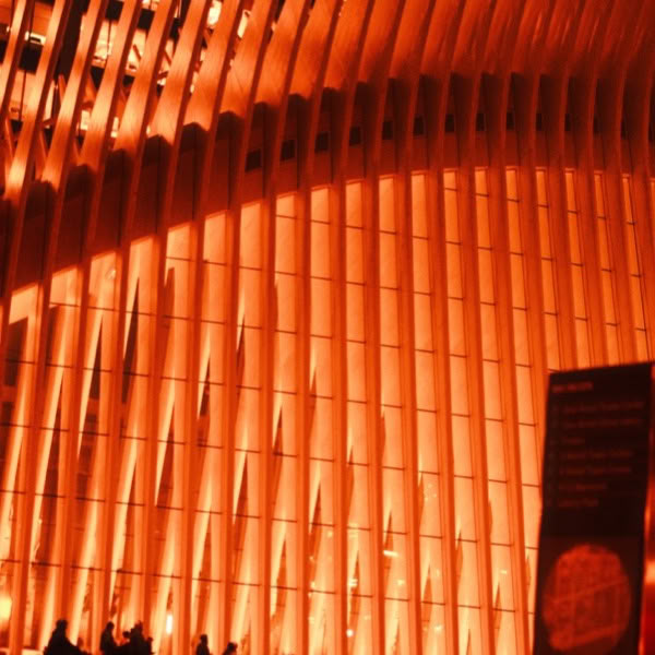 A large building with a curved structure.