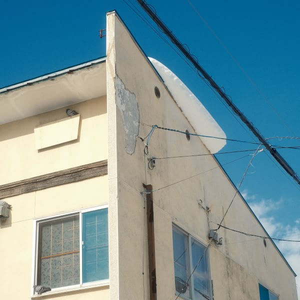 A white building with a window.