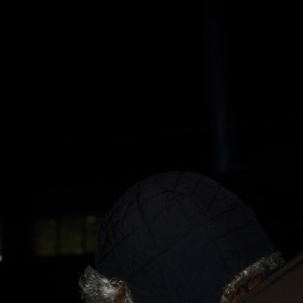 A person wearing a black hat.