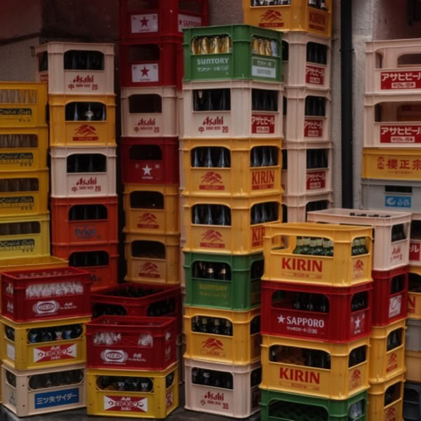 Stacks of beer bottles in a warehouse.