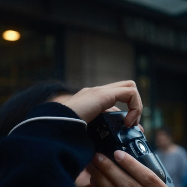 A person holding a camera.