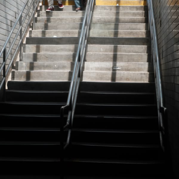 A staircase with a yellow line on it.