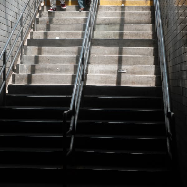 A staircase with a yellow line on it.