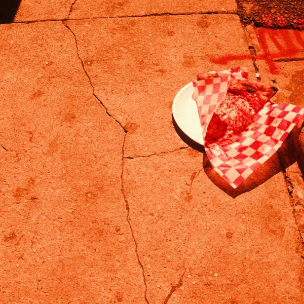 A white plate with a slice of pizza on it.